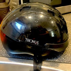 Horse riding helmet.  Trowel.  Small youth
